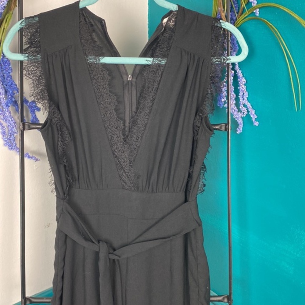 Newburyport Custom sm black v neck jumpsuit ruched sides of legs. Lace trim